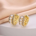 Elegant gold earrings with pearls and zircon on silk background in a side view - Pearl and Zirconia Alternate
