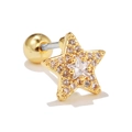Detalle macro de pendiente estrella de oro 18k con circón y cierre de rosca de bola - Pentagrama