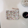 Macro detail of floral cotton pouch with zipper closure and braided pull cord - Small Red Roses