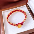 Close-up of handmade red braided bracelet with gold beads and pendant in a wooden box - Gold Relief Lion Head Red Woven Style / 18cm Perimeter/24K Gold Plated