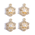 Detail of four golden snowflake pendants with faux pearls and sparkling rhinestones - Gold with Pearl & Rhinestone Snowflake (Pack of 4)