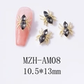 Macro shot of 10.5x13mm spider nail charm with gold metal frame and faceted gemstones - Gold Base Grey Rhinestone (AM08)