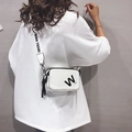 White faux leather crossbody camera bag with black letter print and tassel detail - White