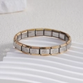 Bracciale modulare italiano in acciaio bicolore con rilievi a forma di sole - Stile con Bordo Dorato e Sole (BD-122)