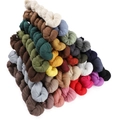 Detailed pyramid stack of twisted solid color linen scarves in various vibrant shades - Custom Color