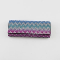 Detailed macro view of colorful wave pattern rhinestones on a luxury glasses case - Blue Wave