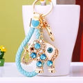 Crystal elephant keychain with blue braided rope and rhinestones on a white cup - Single OPP Bag Packaging / Sky Blue Rope + Blue Crystal Elephant