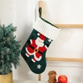 Detail of hanging green velvet Christmas stocking with Santa Claus embroidery and white plush trim - Green Santa Claus