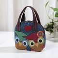 Ethnic style woven handbag featuring colorful owl patterns and a red heart detail - Heart Owl