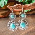 Detail of bohemian drop earrings with turquoise beads hanging on a wooden branch stand - Round Nested Hollow (HQEF-1561)