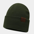 Close-up of dark green ribbed knit beanie featuring a brown leather compass patch - One Size / Army Green