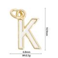 Macro detail of gold letter K pendant with size dimensions 10.9mm by 6.8mm and weight - Letter K