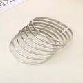Set of 8 minimalist silver polished stainless steel bangles for layered wearing - Inner Diameter 55mm / 7 Rings / Steel