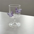 Borosilicate ribbed champagne glass featuring two 3D purple butterfly accents - Striped / Purple