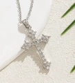 Silver cross pendant necklace with sparkling clear rhinestones on white textured surface - Simple Rhinestone Cross Necklace