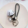 Creative black and white bell keychain with matching checkered woven lanyard strap - Black and White