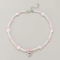 Detail of beaded necklace featuring pink beads and silver heart pendant with Sweetie text - Sweetie Heart Style