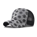 Detail view of plaid maple leaf trucker hat with breathable black mesh and curved brim - Gray