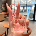 Pink quicksand cartoon bear bag keychain with transparent acrylic heart detail - Peach-Handbag