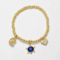 Goldene Perlenarmband mit blauem Opal-Schildkröten-Anhänger und funkelnden Anhängern - Blau