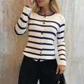 Elegant white cardigan with black stripes, long sleeves, and gold buttons on a model - S / Navy & White Striped