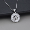 Silver-finish letter W necklace with zircon stones in a circular pendant design - Letter W / Silver