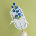 Handmade crochet blue forget-me-not flower on card with Love Is Eternal ribbon bow - Forget-me-not - Dark Blue