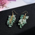Handmade light green natural stone tassel earrings with gold-plated hooks on black background - Gold Hook Style / Green Stones