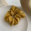 Ginger yellow oversized satin scrunchie with matte texture on white ceramic tray - Yellow