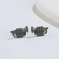 Macro shot of minimalist matte black trumpet shaped stud earrings in stainless steel - Black