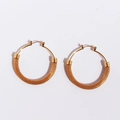 Golden woven mesh hoop earrings featuring a stylish circular metal braid design - Gold