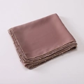 Detail of dusty pink satin hijab featuring a delicate sewn golden bead chain edge - Grey Coffee / 175cm