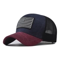 Close-up of embroidered American flag patch on a navy blue and burgundy mesh trucker hat - Adjustable / Navy Blue
