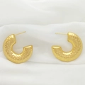 Detail of gold U-shaped earrings with hammered texture on white fabric background - Hammered Texture Style (XL1464-37)