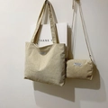Detail view of beige corduroy tote and matching small pouch with metal chain strap - One Size / Tote Bag And Chain Bag / Off White