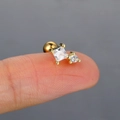 Macro detail of a gold piercing stud with square cubic zirconia held on a fingertip - 8# (Yellow Gold)