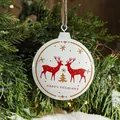 Hand-painted tin Christmas ornament featuring a red reindeer and gold tree design - Double Reindeer
