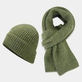 Close-up of thick moss green ribbed knit hat and scarf set for winter outdoor warmth - Green