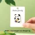 Cute panda enamel pin holding a golden Cai character on a white card background - Fortune Wealth Panda
