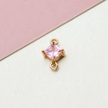 Detailed view of pink zircon rhicombus charm with dual loops for DIY jewelry making - Pink