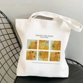 White canvas tote bag with Vincent van Gogh Sunflowers print on minimalist chair - Sunflowers Collection (STD525-J)
