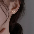 Minimalist golden linear bar stud earrings shown on model ear for a modern look - Gold Line 4-Piece Set