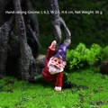 Yoga garden gnome in stretching pose, red shirt and purple hat, 6cm resin statue - Stretching Gnome