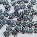 Bulk heart-shaped natural stone pendants in spotted black and white with silver bails - Synthetic Snowflake Stone