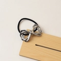 Minimalist elastic hair tie with silver hollow butterfly alloy metal charm on wooden display - 30# Bow Tie Silver