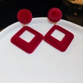 Macro shot of burgundy velvet geometric drop earrings with gold metal on a ceramic plate - Red (925 Sterling Silver Earring Post)
