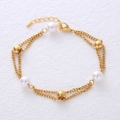 Elegante pulsera de doble capa chapada en oro de 18K con perlas de agua dulce y bolas - Dorado