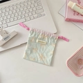 Detail view of a cute mint green drawstring pouch with orange cat prints and pink ties - Printed Cat Light Green