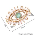 Micro pave Evil Eye jewelry connector with green center stone and white zircon crystals - L373644