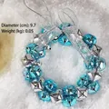 Corona navideña de cascabeles azules y plateados con lazo metálico sobre fondo de nieve - Estilo A Pequeño Plata Azul